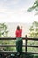 Young female nature explorer enjoying the view from viewpoint