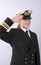 Young female naval officer saluting