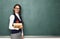 Young female nerd with books