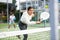 Young female paddle tennis player performing backhand