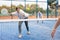 Young female paddle tennis player performing forehand