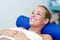 Young female patient on bed in a physiotherapy center.