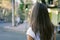 Young female pedestrians cross the road on a green traffic light