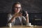 Young female photographer checking an image in a cafeteria