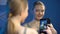 Young female posing for selfie front of mirror, social networks addiction, fun