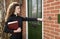 Young female priest making a house call