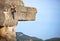 Young female rock climber on a cliff