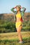 Young female runner posing in park