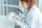Young female scientists examining human skull in laboratory