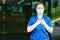 Young female scrub nurse wear blue uniform and face mask