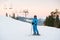 Young female on ski holiday in mountains looking at camera