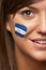 Young Female Sports Fan With Honduran Flag Painted