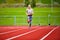 Young Female In Sportswear Running On Sports Tracks