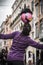 Young female street entertainer performing with her football in the streets of Rome