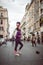 Young female street entertainer performing with her football in the streets of Rome