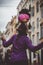 Young female street entertainer performing with her football in the streets of Rome