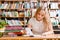 Young female student doing assignments in library