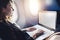 Young female student learning online via netbook while sitting in an airplane cabin