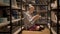 Young female student reading sitting between bookshelves