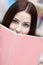 Young female student reads the book