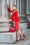 Young female student standing inside office builiding in New York City, looking forward