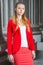 Young female student standing inside office builiding in New York City, looking forward