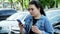 Young female student uses a mobile phone and drink coffee