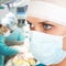 Young female surgeon in OR