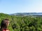 A young female tourist admiring the view of Neddy and Rocky Harbour, Norris Point, and Bonne Bay