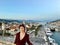 A young female tourist at the top of the Tower Kamerlengo Trogir in the old town of Trogir, Croatia