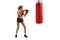 Young female training box with a punching bag