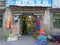 Young female traveler stops by a small grocery store in a Tibetan village.