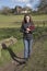 Young female vicar walking in her parish