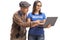 Young female volunteer helping an elderly man with a laptop computer