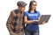 Young female volunteer with a laptop computer helping a senior man with technology