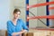 Young female worker standing in warehouse