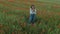 Young feminine blogger woman in flower field