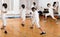 Young fencers training with coach