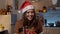 Young festive woman showing gifts to friends