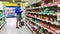 Young finnish man choosing baby food in a suomi supermarket S-Market, in Tampere