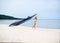 Young, fit and beautiful woman on the beach dancing