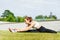 Young, fit and sporty woman stretching in the park. Fitness, sport, urban and healthy lifestyle concept.