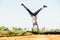 Young fit woman doing simple acrobatics exercise