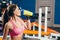 Young fit woman with energy drink relaxing and drinking in the gym. Sport and fittness concept