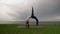 Young fit woman practice yoga on coast near the lake or sea. Woman doing Wheel Urdhva Dhanurasana pose