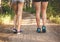 Young fitness girl legs at forest trail at sunset. Sporty women