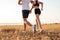 Young fitness man and woman doing jogging sport outdoors