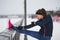 Young fitness woman doing exercise outside at cloudy winter day