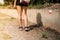 Young fitness woman hiker legs at the right way of the trail. Trekking sign to find the right way and follow the right path