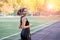 Young fitness woman jogging on running track in the stadium, sports and recreation, healthy lifestyle concept